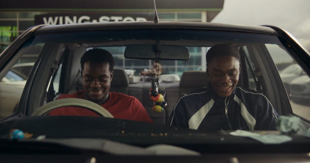 Josh Tedeku as Jamal behind the wheel of his first car in Remi R.M. Moses’ British short film Hindsight.