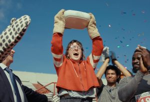 Danielle Pollari as Connie carrying a lasagna on her surreal journey in James Livitski's short film Lasagna Run