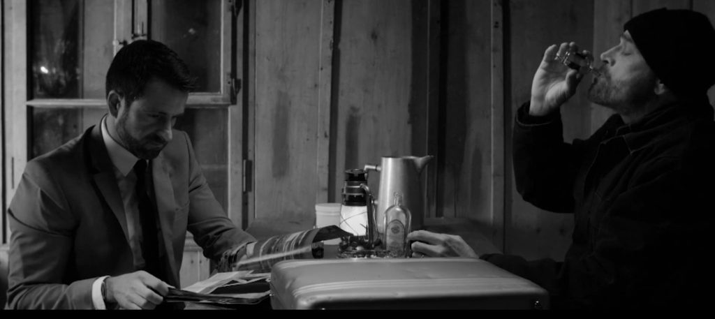 Stuart Reid as the Man in Gray in the black-and-white crime thriller The Man with the Silver Case